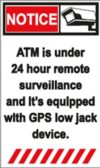 A sign that says atm is under 2 4 hour remote surveillance and it's equipped with gps low jack device.